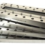 Photo of a stack of 4 stainless steel pyraflat viewports
